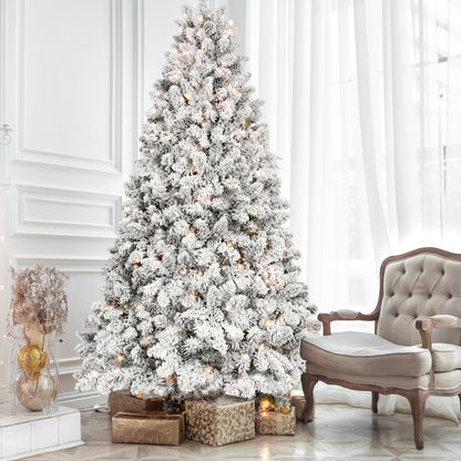 Flocked Pre-Lit Christmas Tree beside an armchair