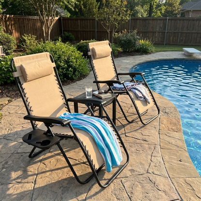 Zero gravity chairs beside a backyard pool