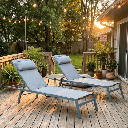 Aluminum chaise lounges on a patio deck at golden hour